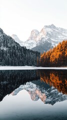  Serene landscape featuring majestic mountains with reflection on a calm lake, surrounded by tranquil forest scenery in autumn colors.