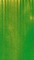 Poster - Gold glitter cascades elegantly, gradually covering a vibrant green background. This enchanting display fosters a festive mood, ideal for celebrations and joyful occasions