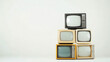 © Robert Kneschke - Stack of vintage televisions in black and white on a minimalist background
