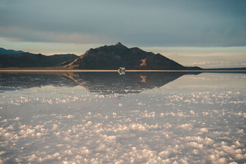 Reflection of mountains and the sky on the Bonneville Salt Flats in Utah.