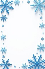 Wall Mural - blue snowflakes arranged in a decorative border on a clean white background, winter-themed illustrat