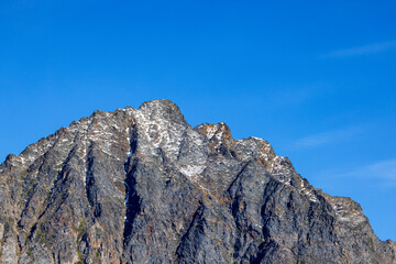 Wall Mural - mountain top and blues sky in liverpool land, northeast greenland national park, the peaks are cover