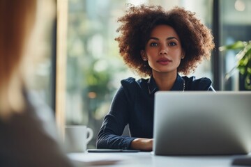 Poster - A person sitting at a desk with a laptop and working on a task, possibly for work or school