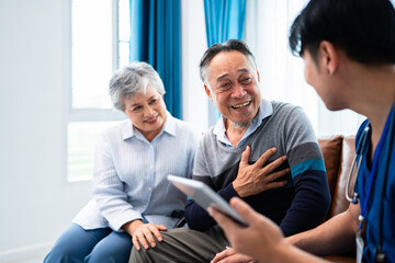 asian senior man consult and discuss his medical examination results with caregiver at premium clinic, elderly retirement people get nursing home care wellness service for healthy lifestyle