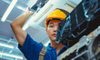 © Bartek - Technician in Safety Gear Repairing Ceiling Air Conditioning Unit in Modern Office Building during Daytime, Focused on Maintenance and HVAC System, Indoor Work Environment
