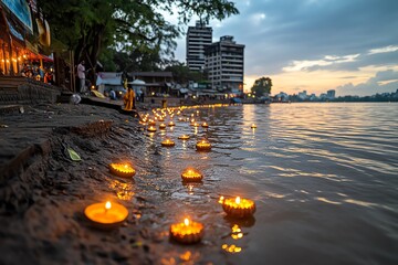 Aufkleber - A peaceful riverbank scene during the Festival of Lights, with small diyas (oil lamps) floating gently on the water, symbolizing the victory of light over darkness