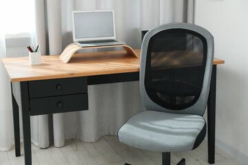 Canvas Print - Grey chair, laptop and desk in office