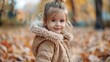 © AlfaSmart - Adorable Little Girl Smiling in Fall Leaves