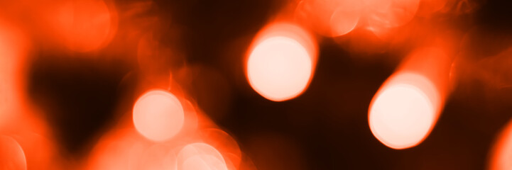 Wall Mural - Blurred lights, dark orange background, banner texture. Abstract bokeh with soft light header. Panoramic web banner with copy space for design
