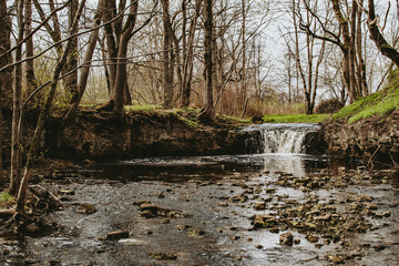 Ivande river with small waterfall in Latvia at spring