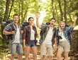 © Ljupco Smokovski - Group of young hikers with backpacks in a forest