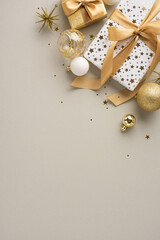 Sticker - Luxurious vertical Christmas presents wrapped with gold bows alongside sparkling ornaments and stars on a neutral background, evoking a festive and elegant holiday atmosphere