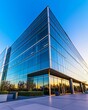 © TimosBlickfang - Modern glass office building exterior reflecting sunset, ideal for corporate headquarters, urban architecture, commercial real estate, or contemporary business environments