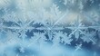 © somporn - Snowflakes on a windowpane with frost patterns
