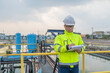 © reewungjunerr - Environmental engineers work at wastewater treatment plants,Water supply engineering working at Water recycling plant for reuse