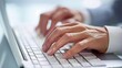 © ELENA AI - A close-up view of a businessman typing on a laptop, demonstrating modern technology and communication. This image is perfect for business, finance, and educational content.