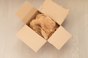 Corrugated paper for safe transportation, courier delivery service are packed, ecological packaging concept