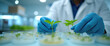 © 2April - Scientist Hands Planting Saplings, Biotechnology Research.