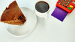 © Marlon - Piece of cake, cup of coffee, and bankig P.O.S payment terminal on the white background with copy space.