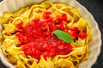 Pasta tagliatelle tomato sauce second course tasty food dish fresh delicious gourmet food background on the table rustic food top view copy space