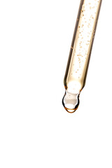 Poster - Transparent pipette with cosmetic liquid on a white background. Essential oil dropper close up.