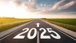© NASSRI - Road to 2025 with an empty road with written 2025 and arrow pointing towards the horizon to represent the future and positivity and success of the new year 2025 in sunset highway for motivation vision