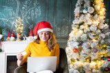 Fototapeta Big Ben - woman doing online Christmas shopping