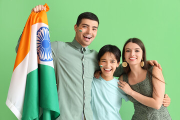 Happy family with Indian flag on green background