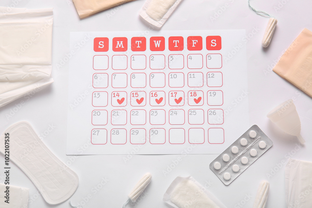 Menstrual calendar with pads, tampons, cup and pills on white background