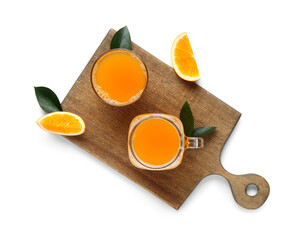 Canvas Print - Wooden board with jar and glass of tasty orange juice on white background