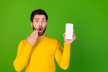 Aufkleber - Photo portrait of pretty young male hold white screen device qr code amazed wear trendy yellow outfit isolated on green color background