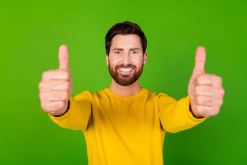 Aufkleber - Photo of optimistic man with stylish beard dressed yellow shirt showing you thumbs up approve good job isolated on green color background