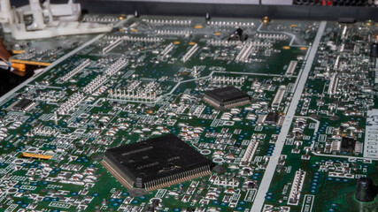 Poster - A computer board with many small parts on it