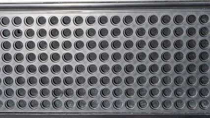 Aufkleber - A close up of a black object with many small holes
