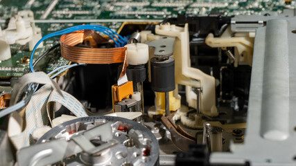 Poster - A close up of a broken old fashioned tape recorder