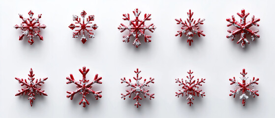 red snow flakes in different shape. red snow flakes on white background.