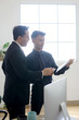 © Gatot - Two Professional Businessman Manager Explaining Chart or Graph on Paperwork
