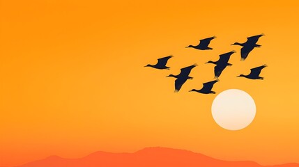 Poster - Silhouettes of birds gracefully soaring in a vibrant orange sky at the tranquil break of dawn creating a serene and breathtaking natural scene