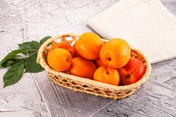 Raw ripe sweet apricots heap