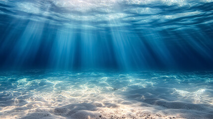 Wall Mural - underwater background deep blue sea and beautiful light rays with sandy floor: an underwater scene w