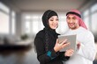 © BillionPhotos.com - Mature Muslim arab couple work at home