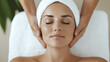 © Marketplace - A serene woman enjoys a relaxing facial massage at a spa, emphasizing tranquility and self-care in a calming environment.