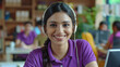 © Niks Ads - A woman wearing a purple shirt is smiling and wearing headphones