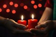 © Photographybd60 - hands holding a candle