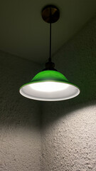 Green hanging lamp with white light against white wall. Close-up of black lamps on ceiling. Modern interior.