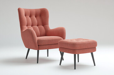 an armchair with a matching ottoman upholstered in soft fabric