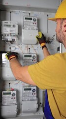 Wall Mural - Technician working on a modern electricity power meter station in a building.	
