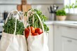 © Nazmi - Reusable shopping bags filled with fresh vegetables, soft natural light, eco-friendly kitchen background.