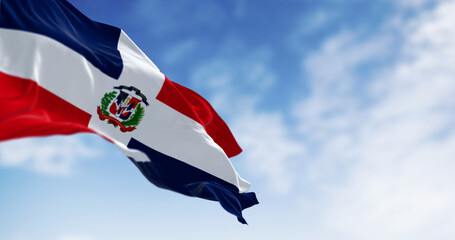 Detail of the national flag of the Dominican Republic waving in the wind on a clear day