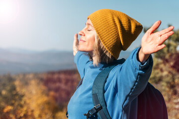 female with backpack on hike in nature